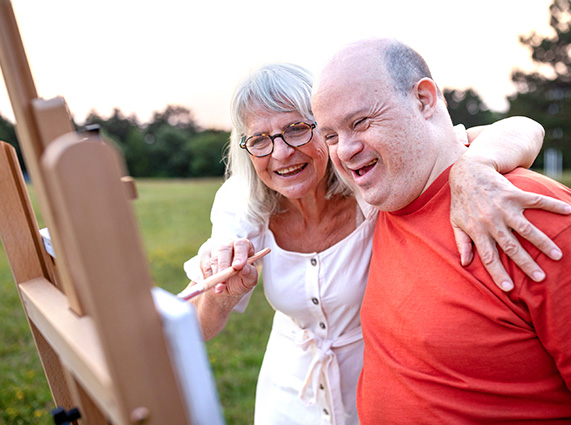 Adults painting in the park